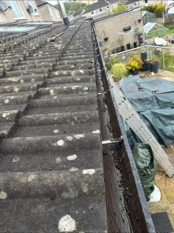 The same roof gutter after cleaning, with the channel cleared